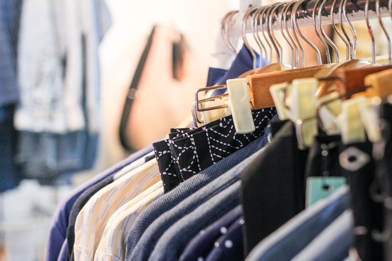 A vibrant assortment of clothing hanging on racks in a trendy fashion boutique.